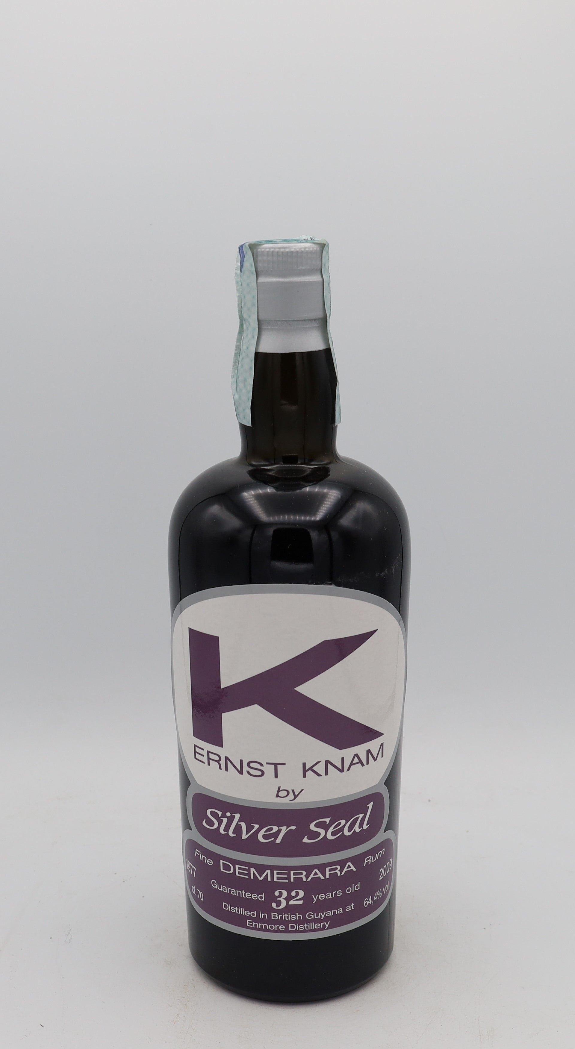 An Enmore 1977 Demerara Rum Ernst Knam Silver Seal, bottle 208, presented in a collector’s box – rare aged Caribbean rum with rich, complex flavors.