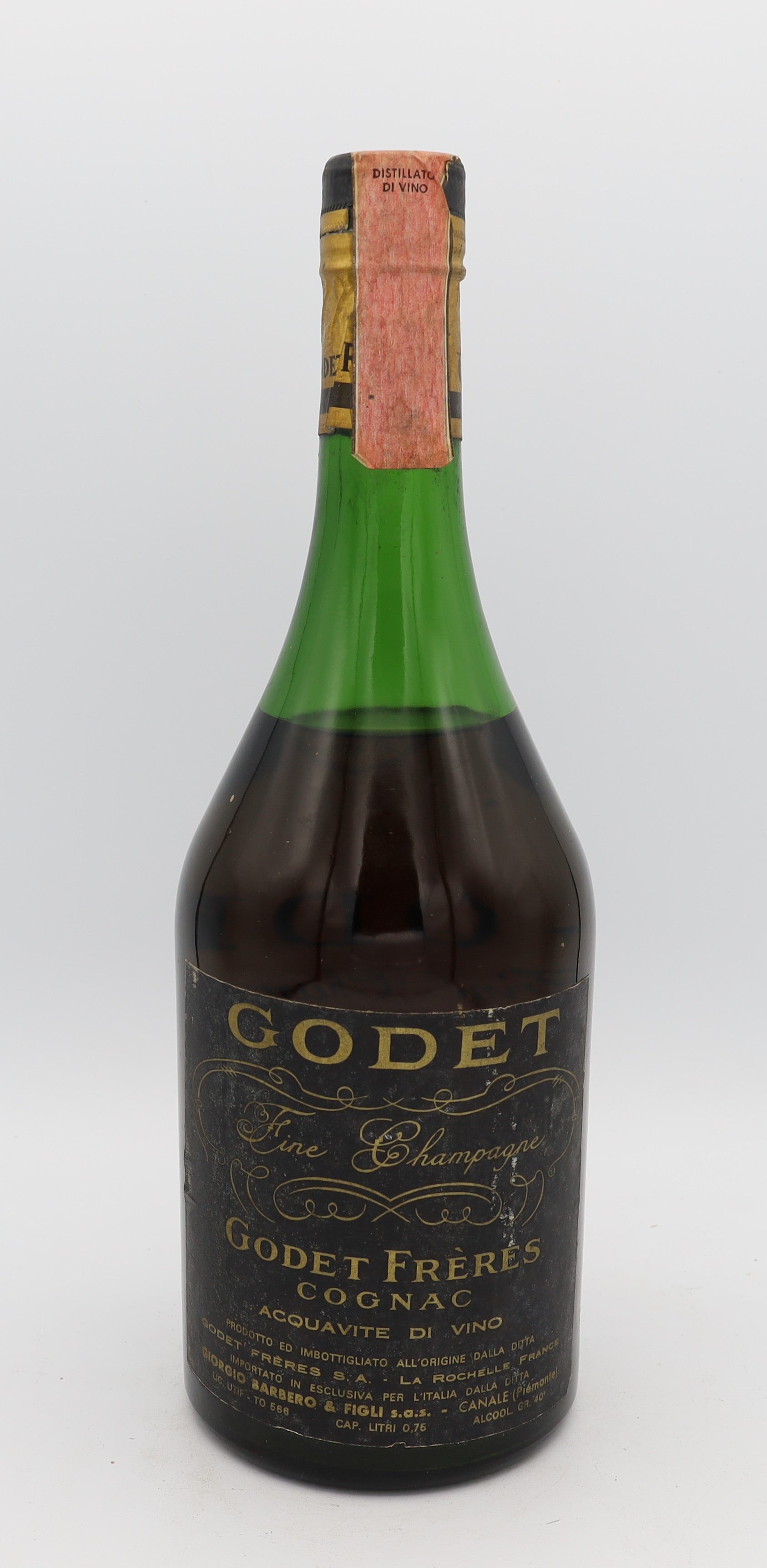 Back view of Godet Frères Fine Cognac in a green bottle with silk label – elegant French brandy showcasing craftsmanship, heritage and refined presentation.
