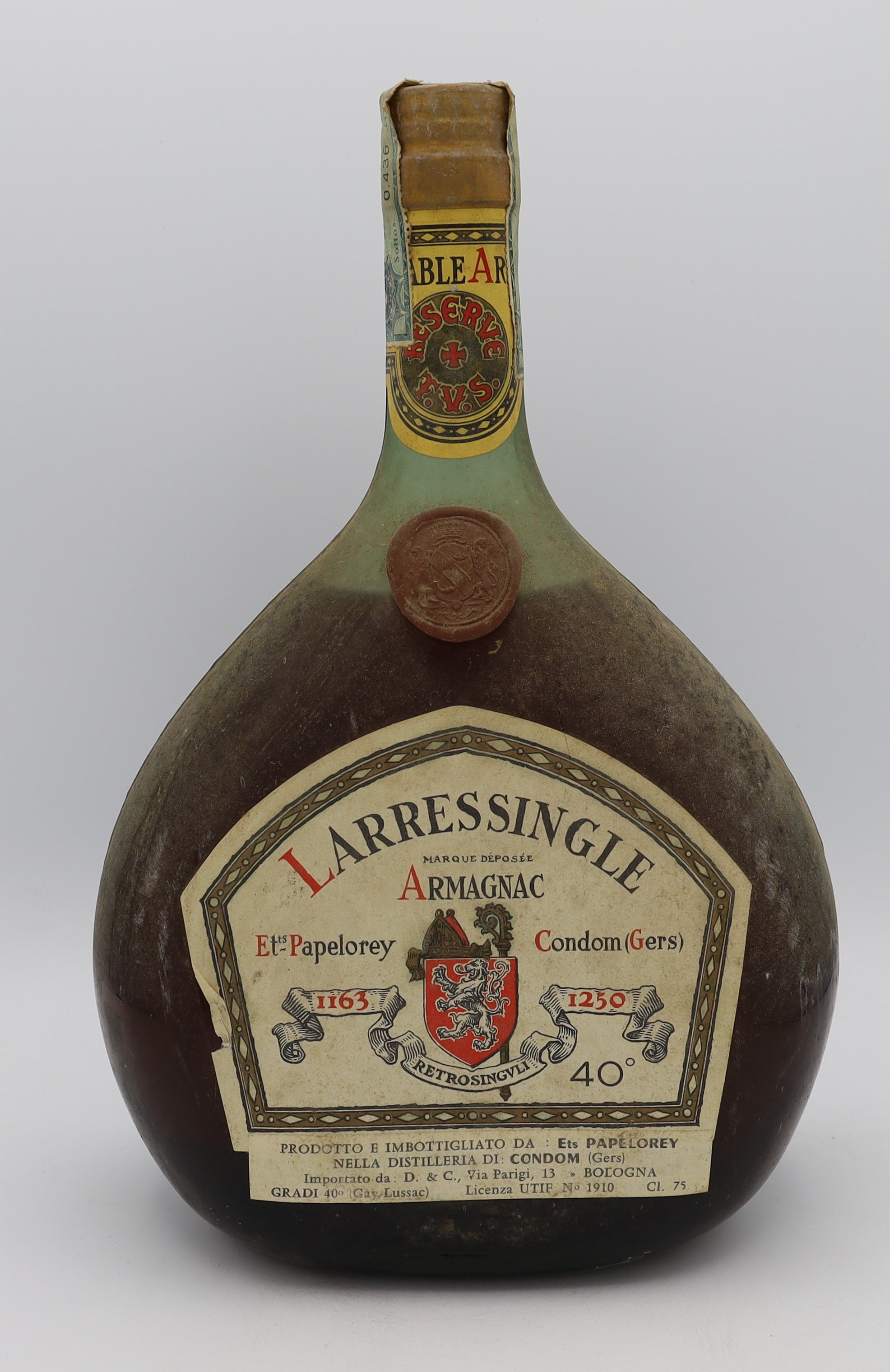 Larressingle Armagnac in red wax dumpy bottle – premium aged brandy with rich, complex flavors, presented in a distinctive collector’s bottle.