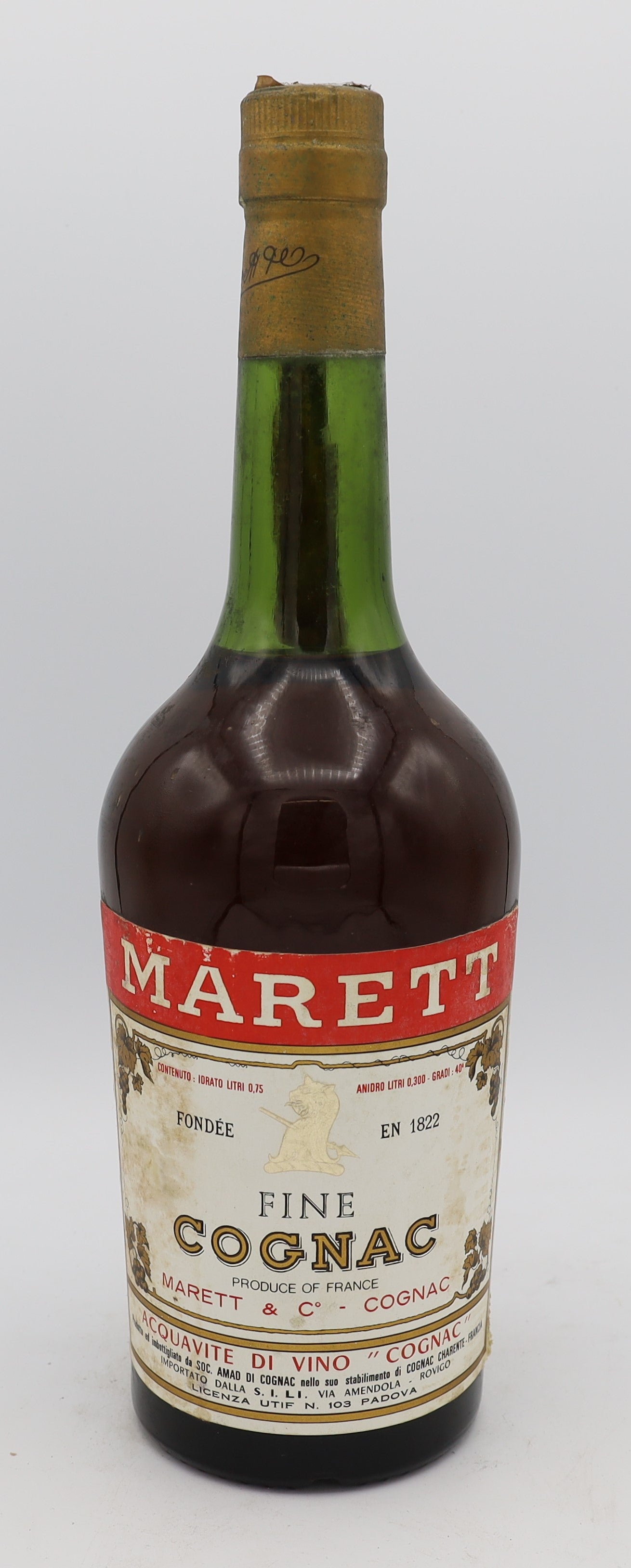 Marett Fine Cognac with gold cap – vintage French brandy in an old bottle, offering rich amber color and smooth, refined flavors for collectors and connoisseurs.