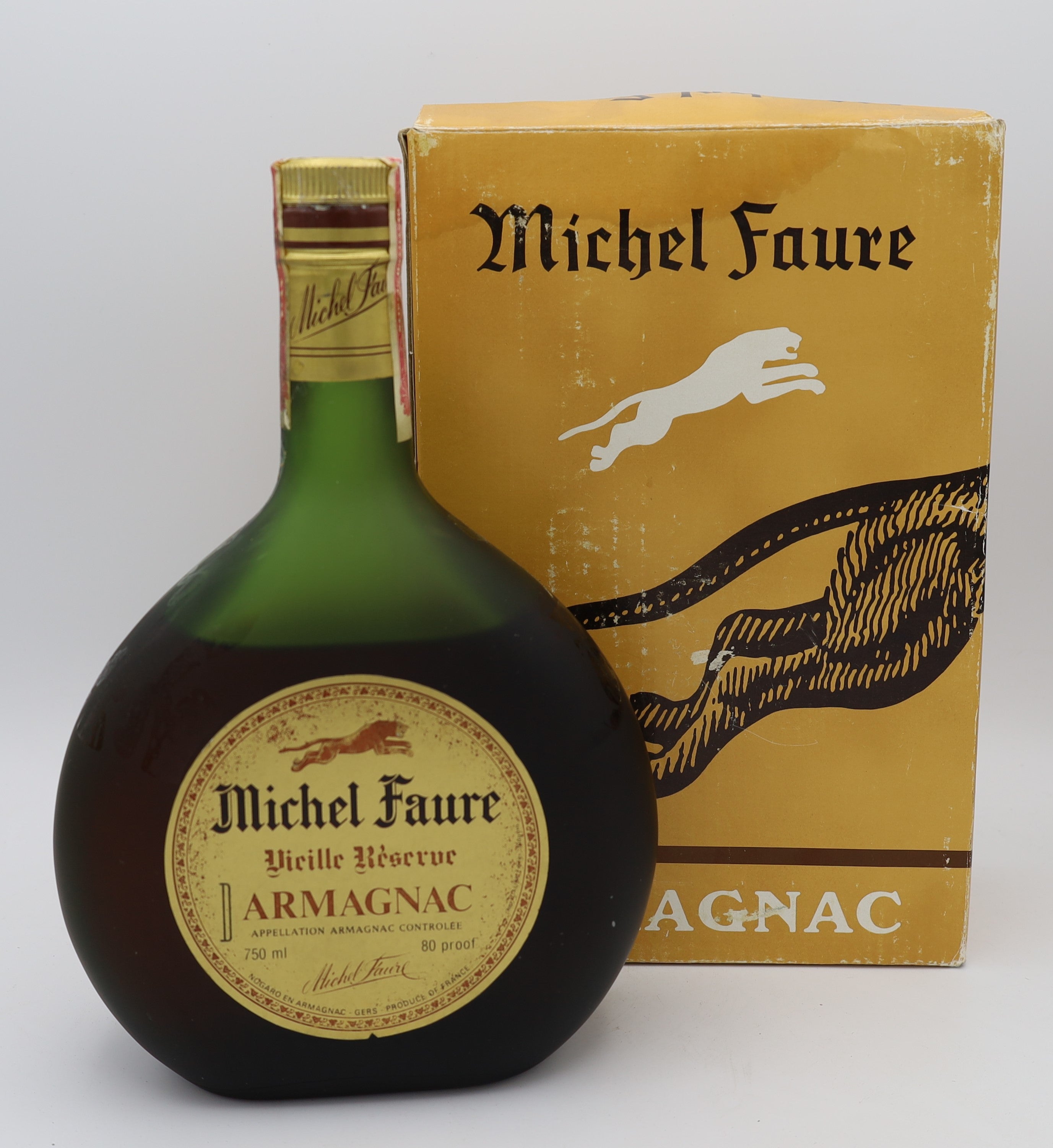 Michel Faure Vieille Reserve Armagnac with gold label in green bottle – premium aged brandy with rich, smooth flavors, ideal for collectors and connoisseurs.
