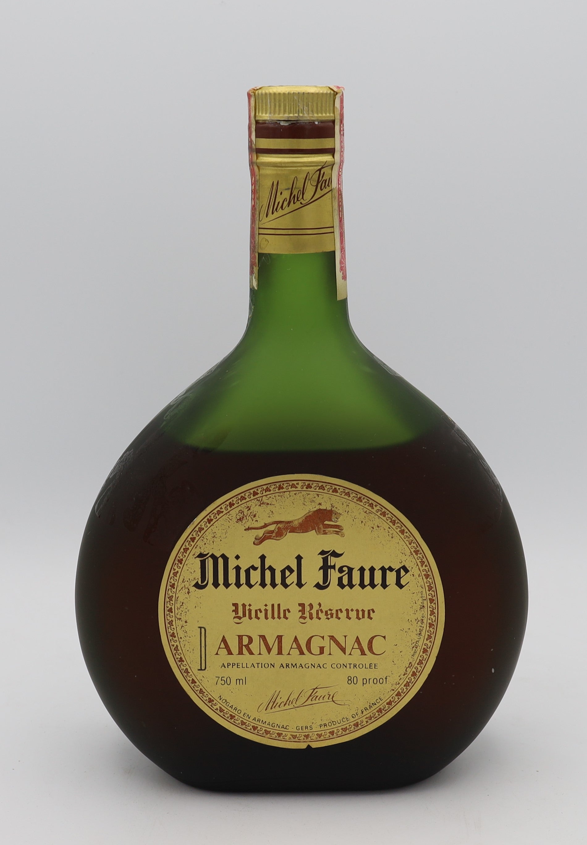 Michel Faure Vieille Reserve Armagnac with gold label in green bottle – premium aged brandy with rich, smooth flavors, ideal for collectors and connoisseurs.